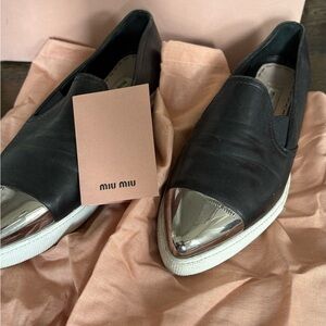 Miu Miu Black Slip-On Sneakers with Silver Cap Toe